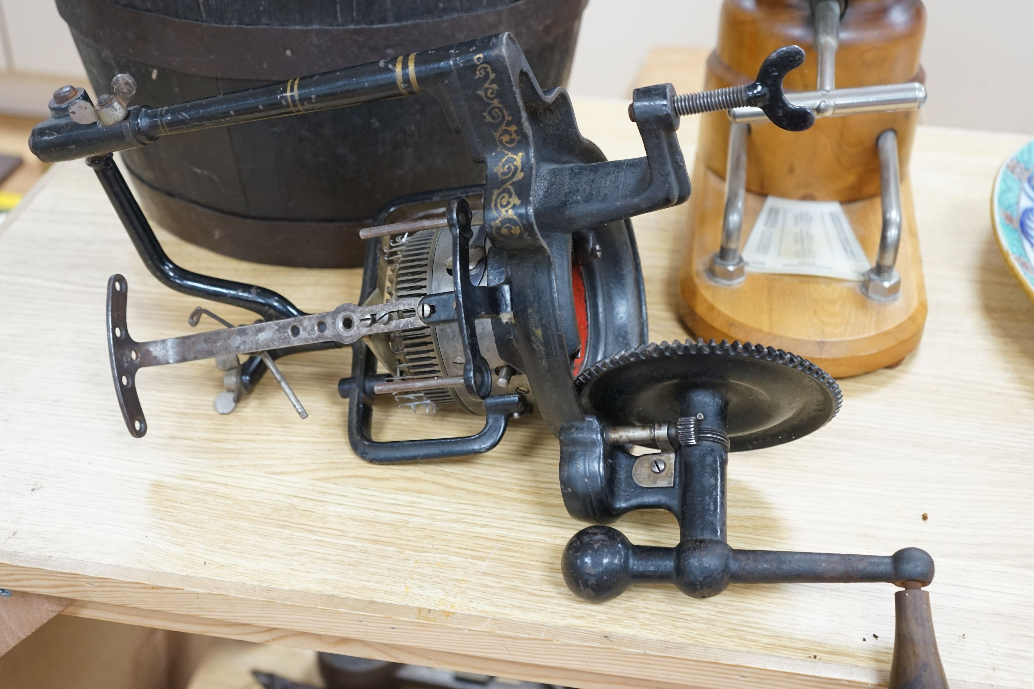 A wooden hat stretcher, 35cms high and a sock making machine